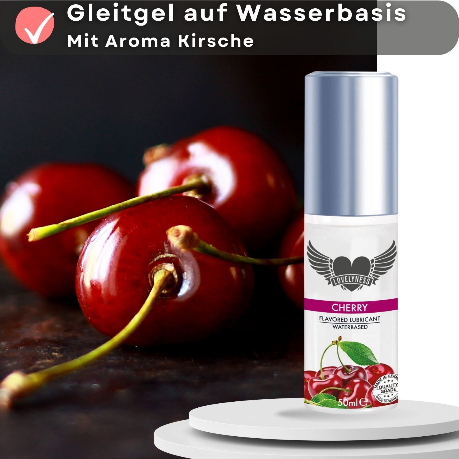 Gleitgel-Flasche mit Kirsch-Aroma. Kirschen abgebildet. Text: Gleitgel auf Wasserbasis, mit Aroma Kirsche.