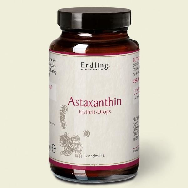 Braune Glasflasche mit schwarzem Deckel. Etikett mit "Erdling" und "Astaxanthin Erythrit-Drops".