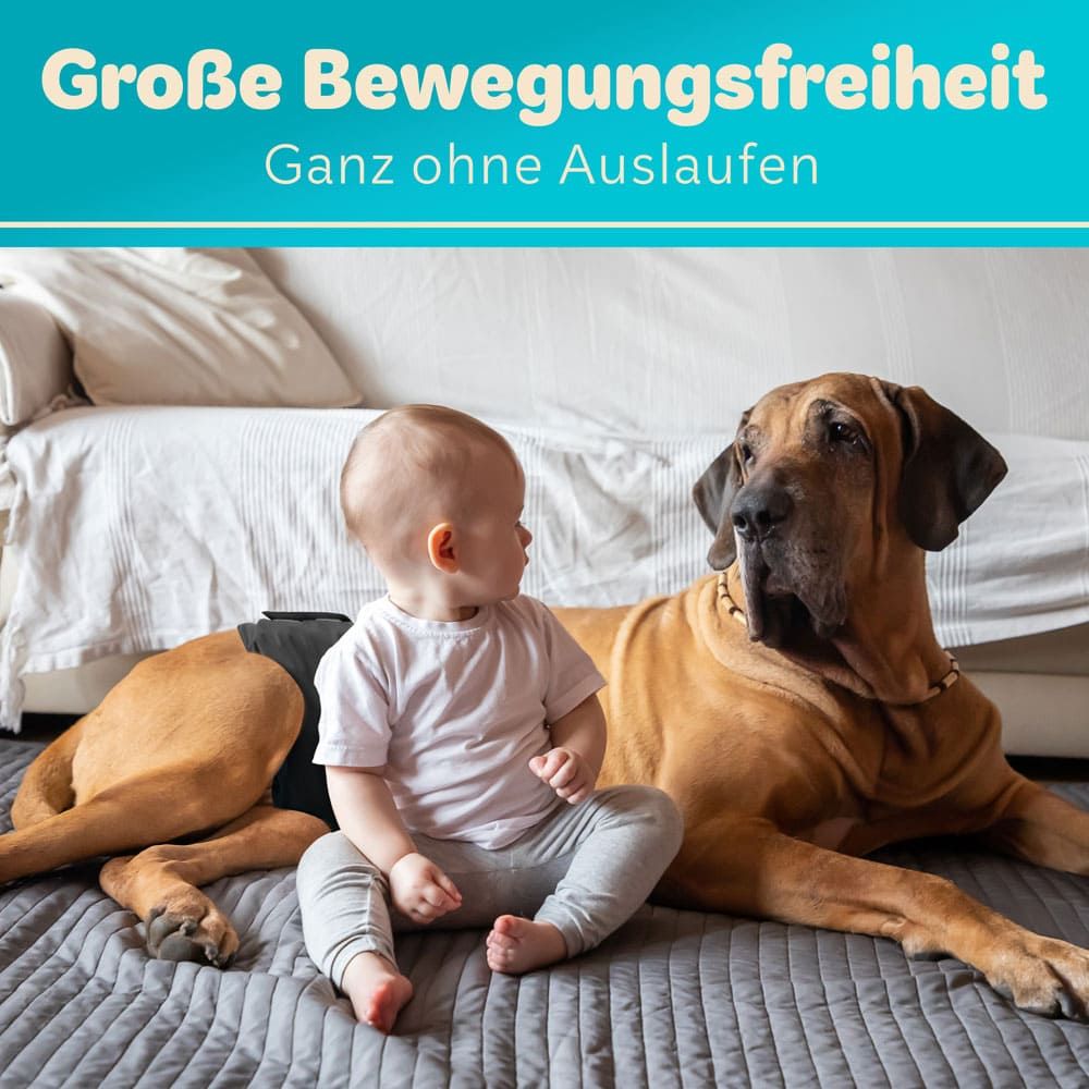 Hund und Baby auf einer Couch. Hund trägt eine Windel. Text: Große Bewegungsfreiheit, ganz ohne Auslaufen.