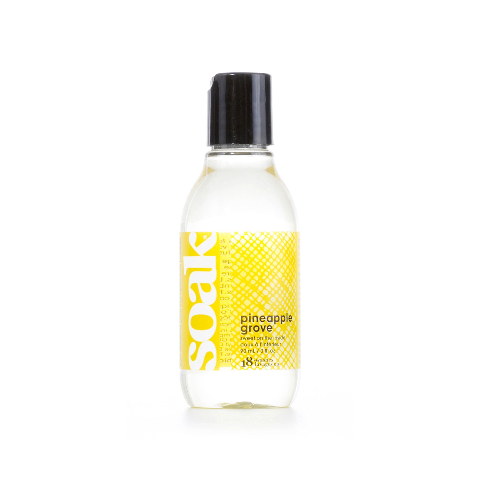 Klare Flüssigkeit in einer Flasche mit schwarzem Deckel. Auf dem Etikett steht "soak" und "pineapple grove".