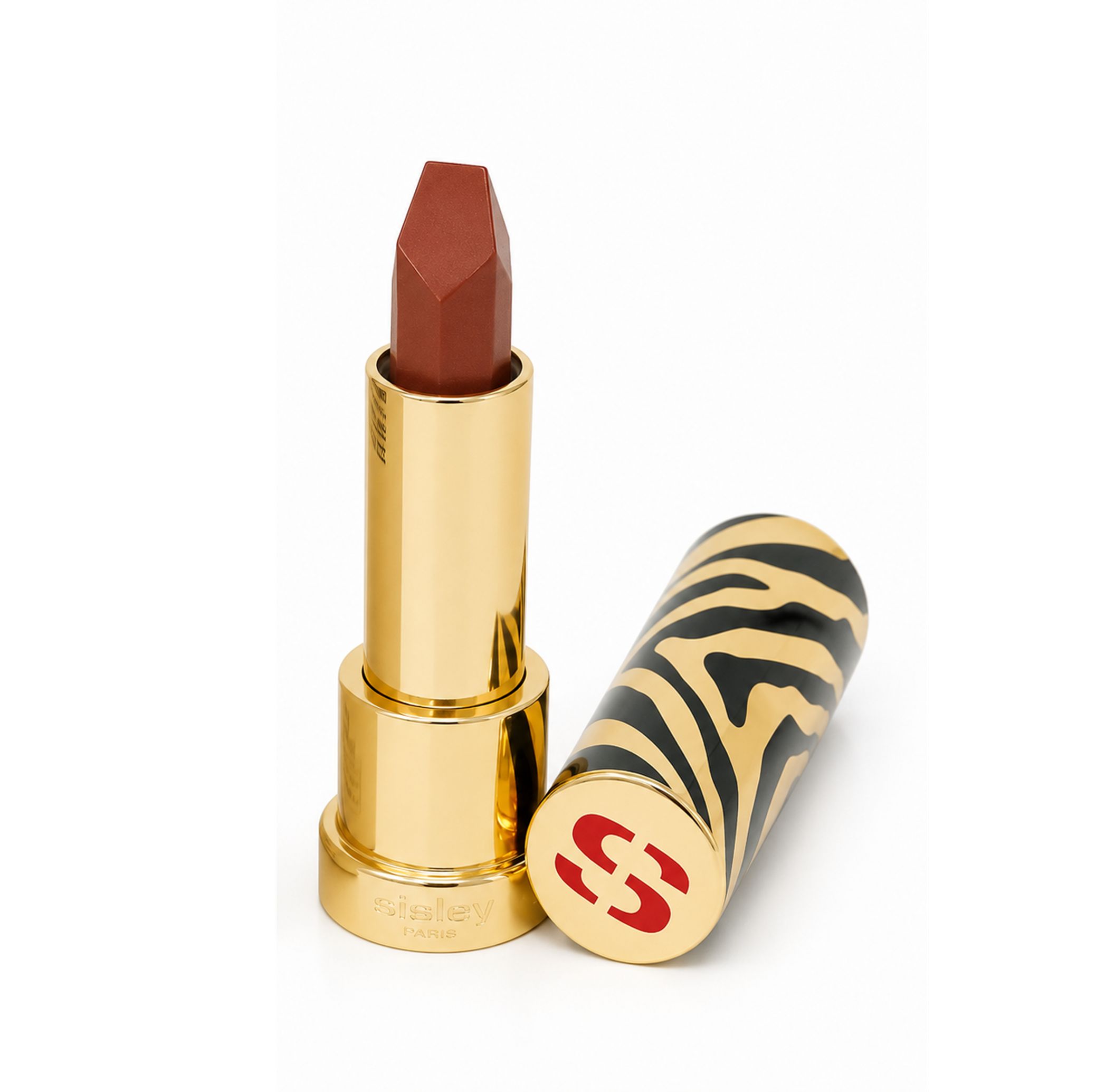 Sisley Le Phyto Rouge Lippenstift mit goldfarbenem, zebra-gemustertem Deckel und rotem 'S'-Logo.