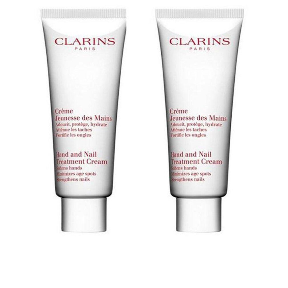 Zwei Tuben Clarins Crème Jeunesse des Mains. Weiß, mit roter Schrift. Text: Hand and Nail Treatment Cream.