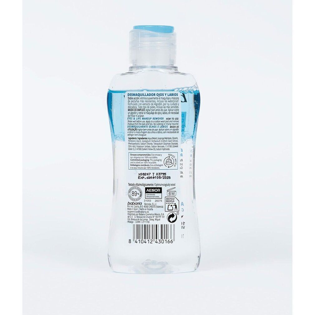 Rückansicht einer transparenten Flasche mit blauem Inhalt und blauem Deckel. Aufschrift und Logos.