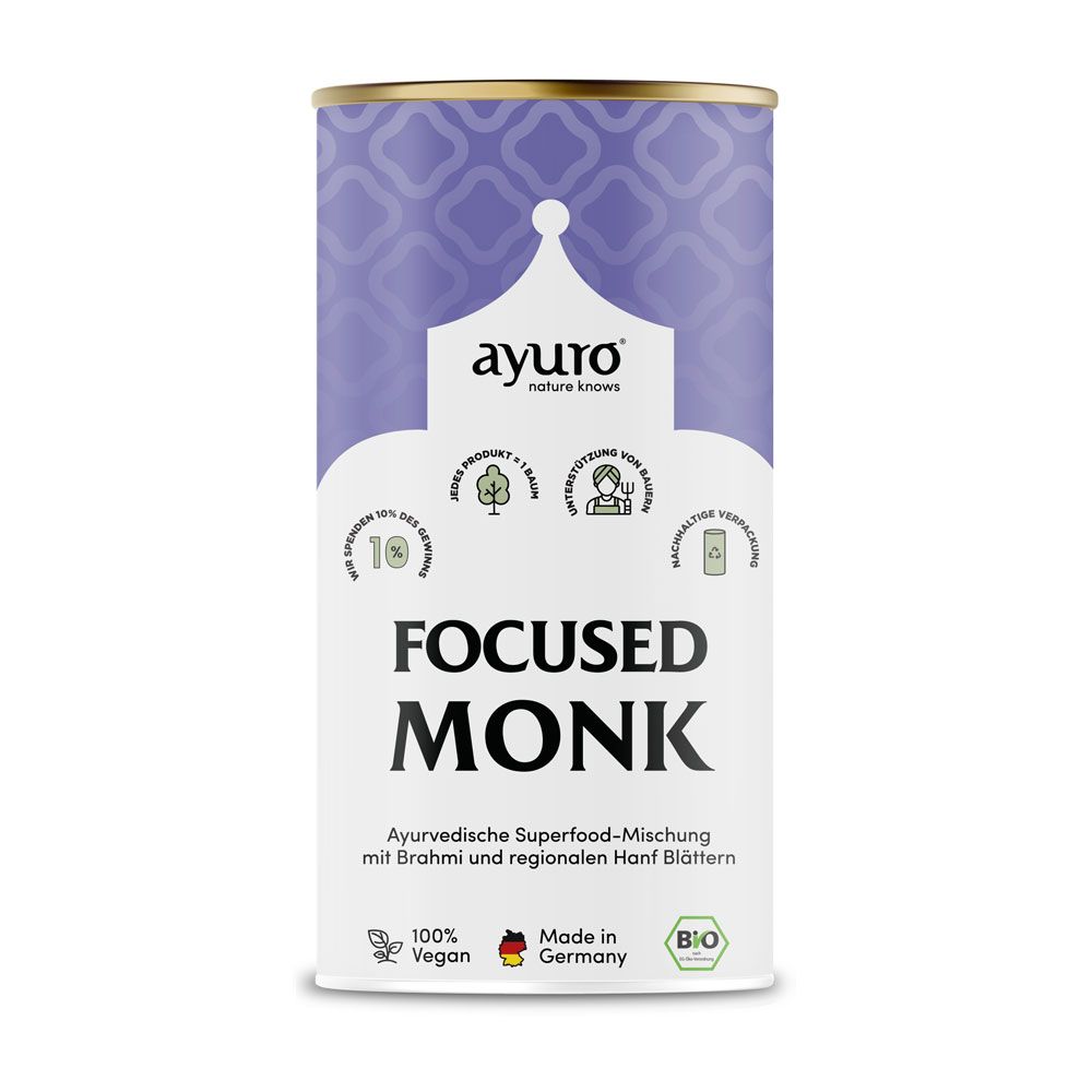 Zylindrische Dose mit weißem Etikett. Aufschrift: "ayuro Focused Monk". Logo, Bio-Siegel, Herkunftsangabe. Lila Muster.