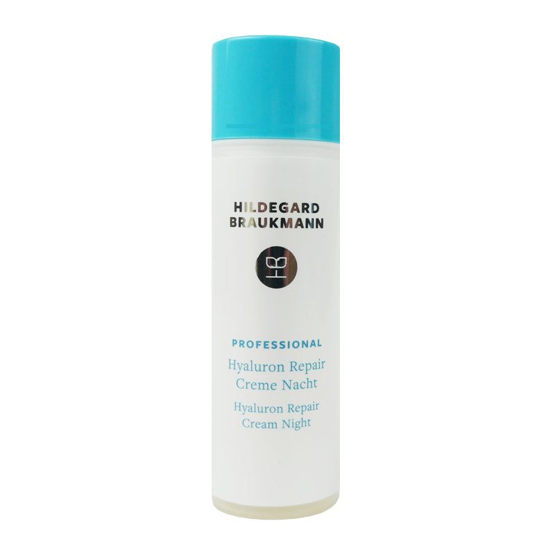 Zylindrische Flasche mit blauem Deckel. Marke Hildegard Braukmann. Text: PROFESSIONAL Hyaluron Repair Creme Nacht. Logo. Weißes Etikett.