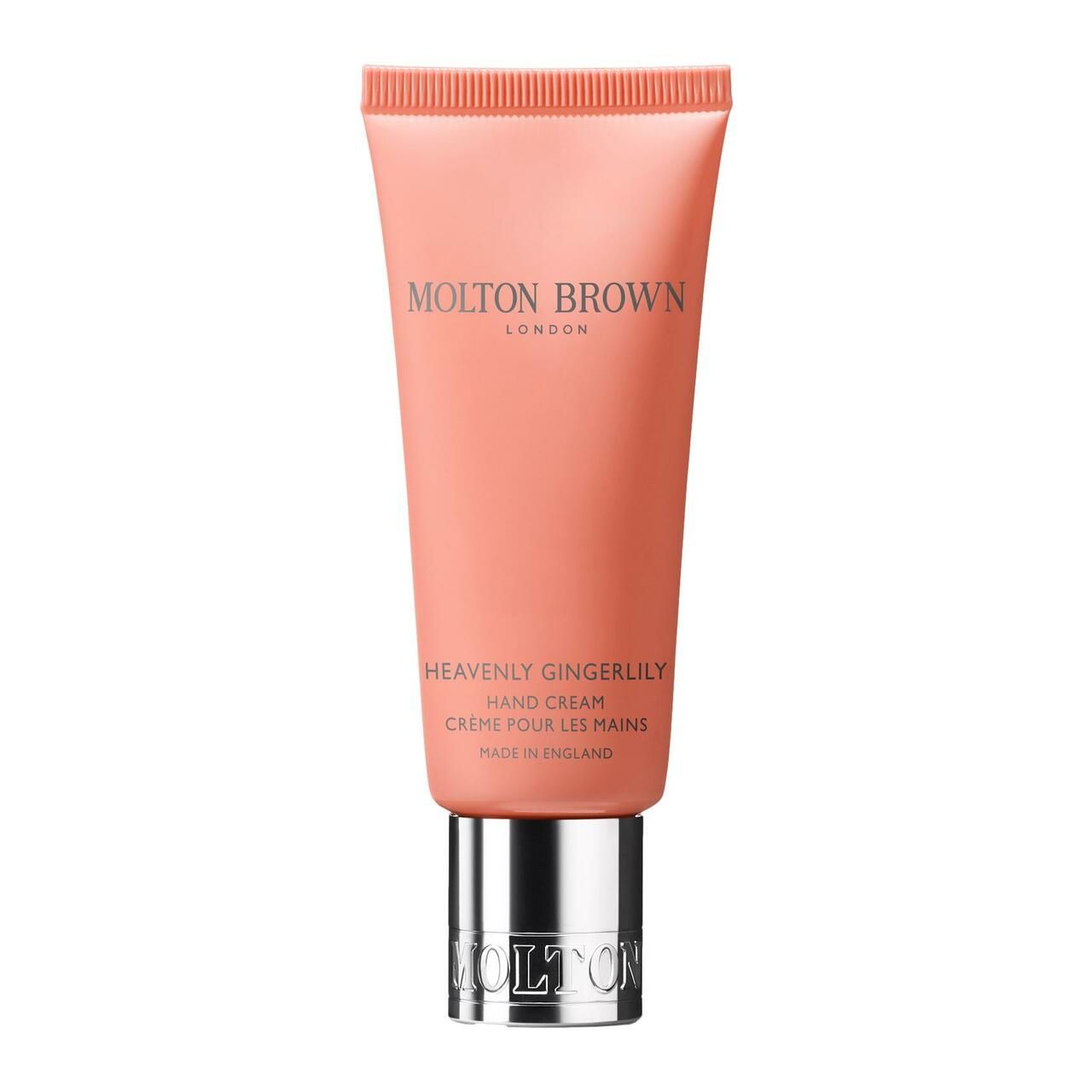 Rosa Handcreme-Tube mit silberner Kappe. Aufschrift: Molton Brown, Heavenly Gingerlily Hand Creme.
