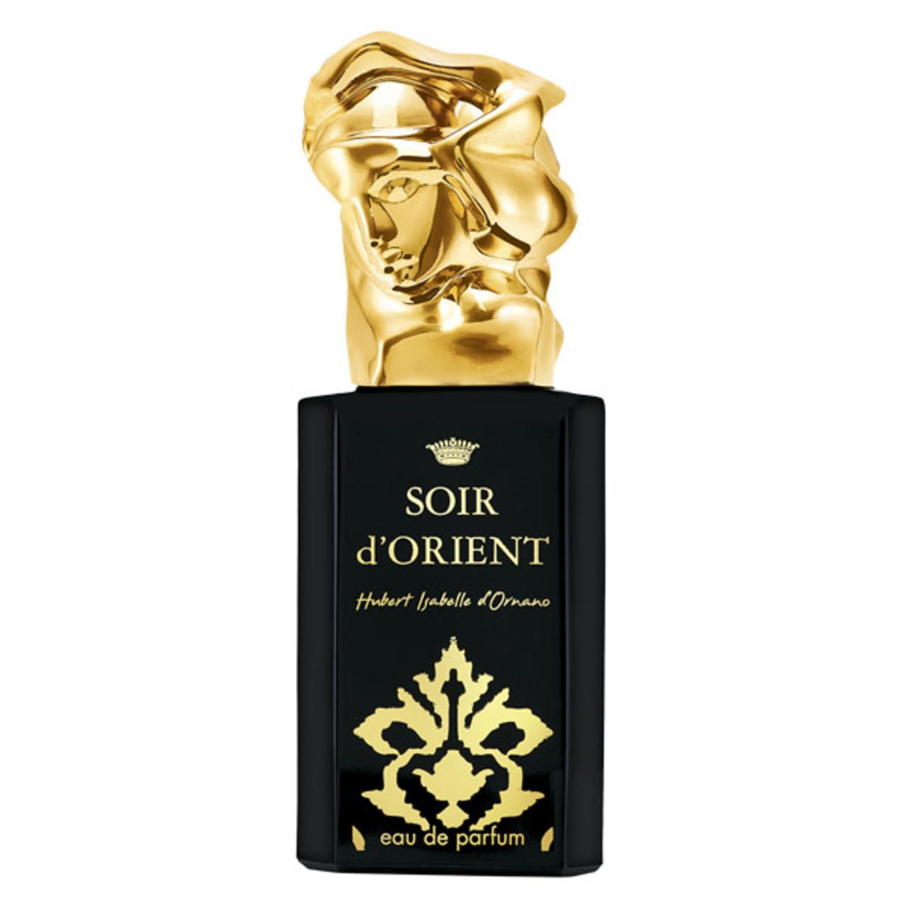 Schwarzer Flakon mit goldenem Aufsatz in Form eines Kopfes. Aufschrift: Soir d'Orient, Eau de Parfum. Goldene Verzierungen.