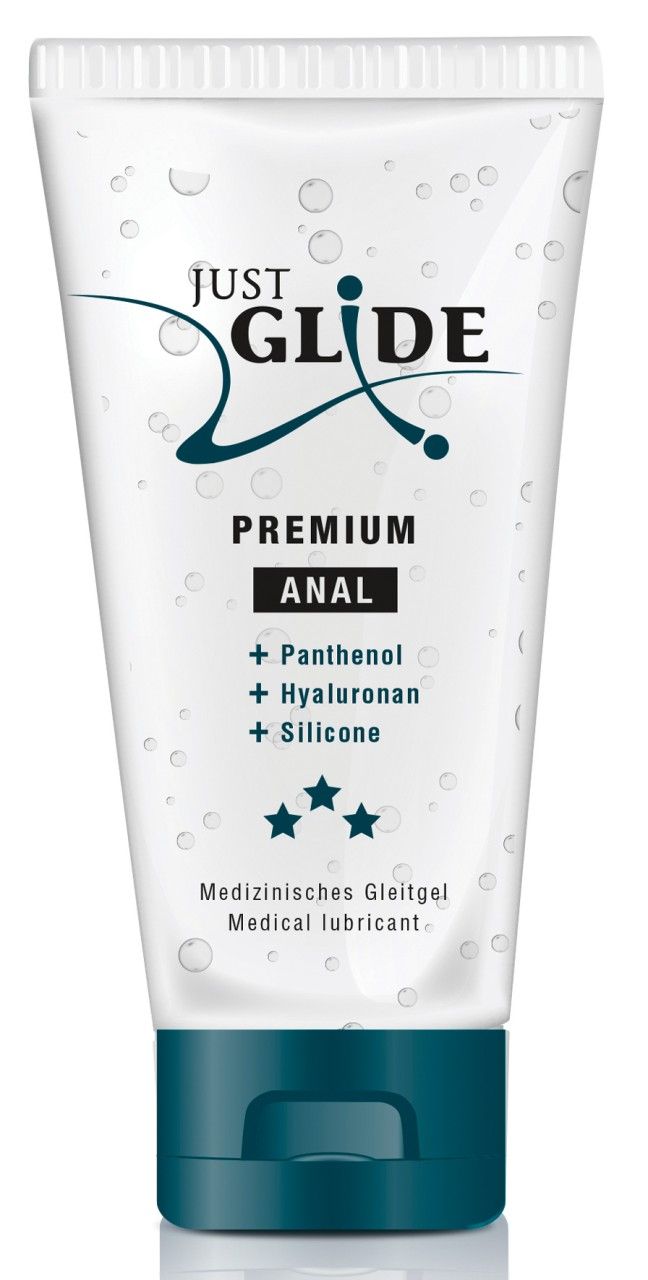 Tube Gleitgel. Aufschrift: JUST GLIDE PREMIUM ANAL. Enthält Panthenol, Hyaluronan, Silikon. Medizinische Formulierung. Blaue Verschlusskappe.