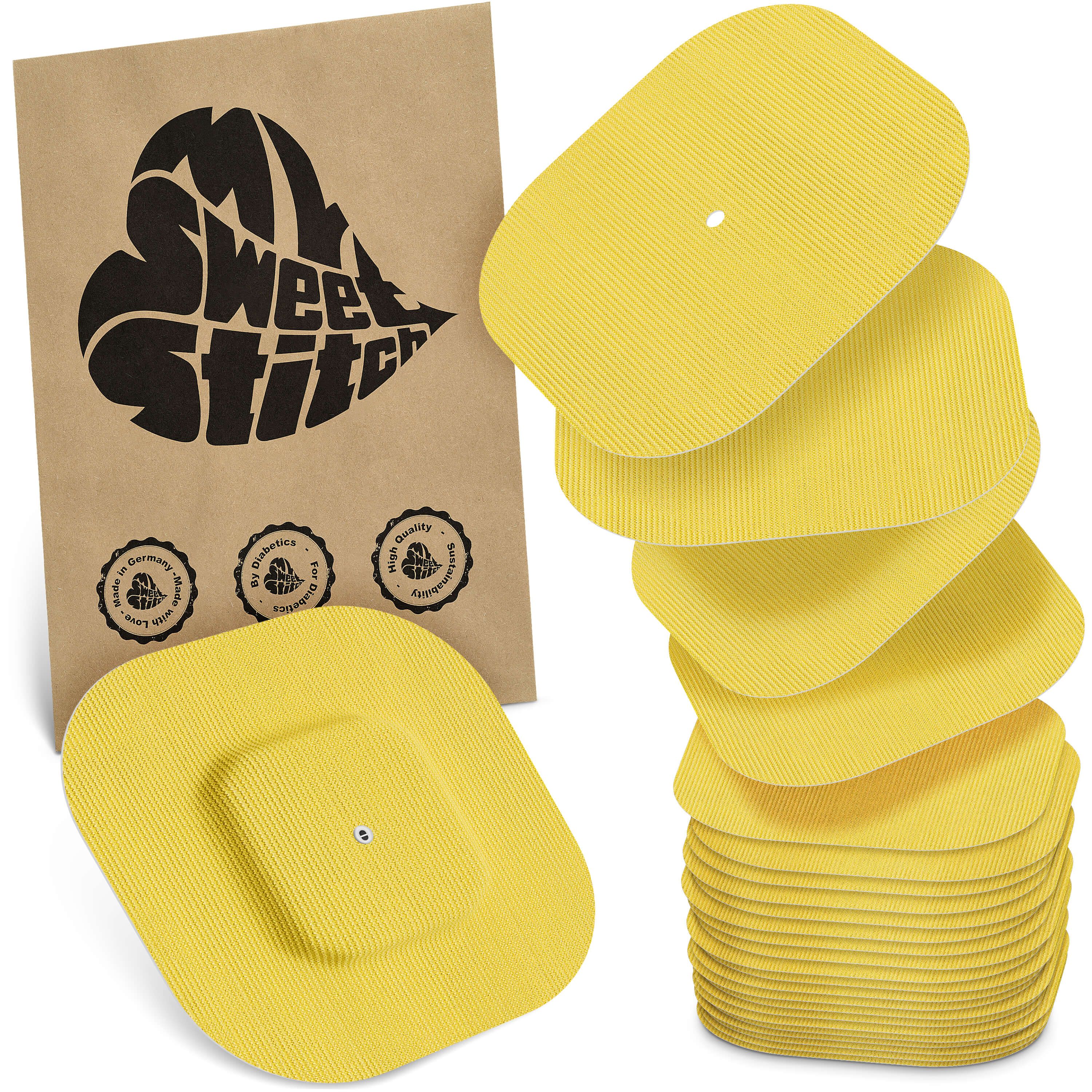 Gelbe, quadratische Pflaster mit geriffelter Oberfläche. Eine Packung mit Logo und Qualitätssiegeln. Stapel von Pflastern.