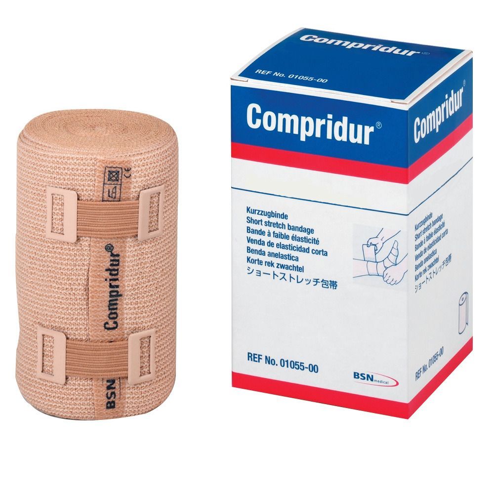 Bandage gerollt, beige. Box mit Aufschrift Compridur, Kurz-Zugbinde. BSN-Logo.