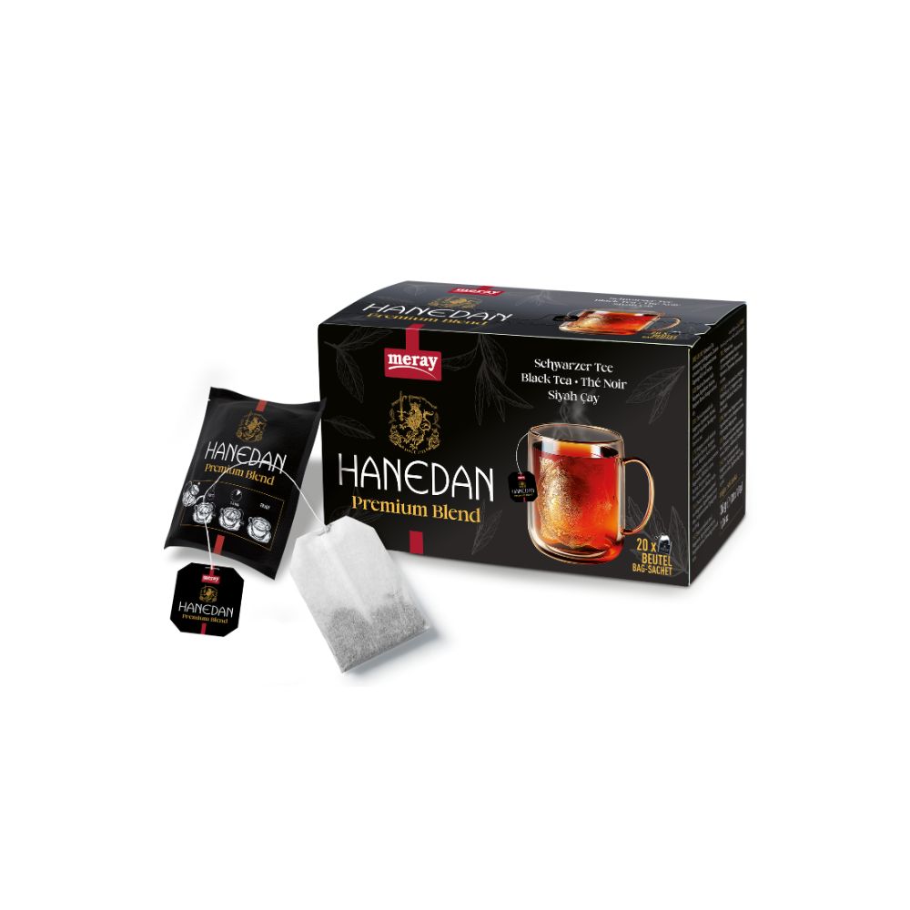 Schwarzer Tee von MERAY Hanedan. Schwarze Verpackung mit Logo und Tasse Tee. Einzelne Teebeutel und Teebeutel-Verpackung.