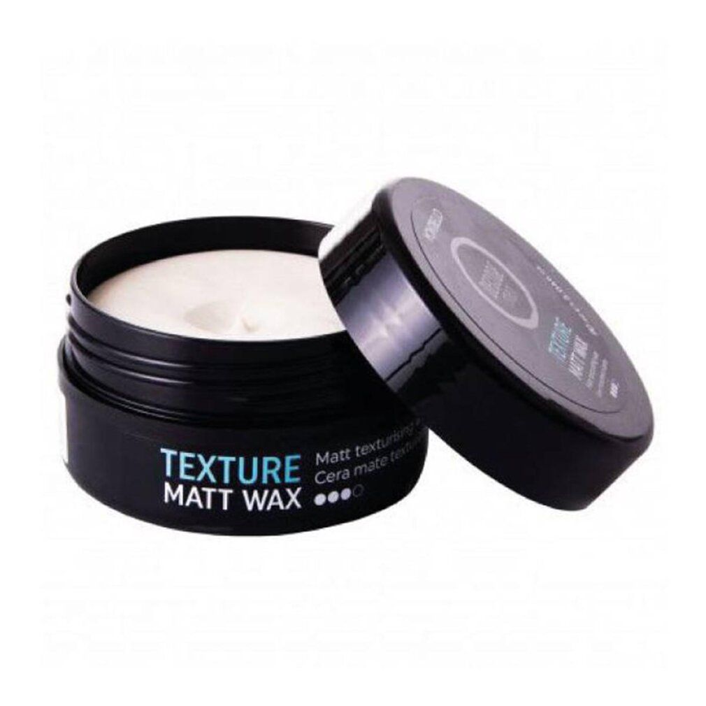 Schwarzer Tiegel mit geöffnetem Deckel. Aufschrift TEXTURE MATT WAX. Produktname und Eigenschaften sind auf dem Tiegel angegeben.