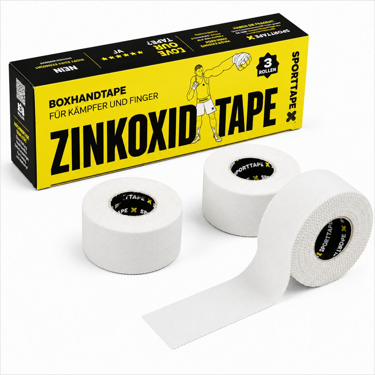 Drei Rollen weißes Zinkoxid-Tape und eine offene Box.