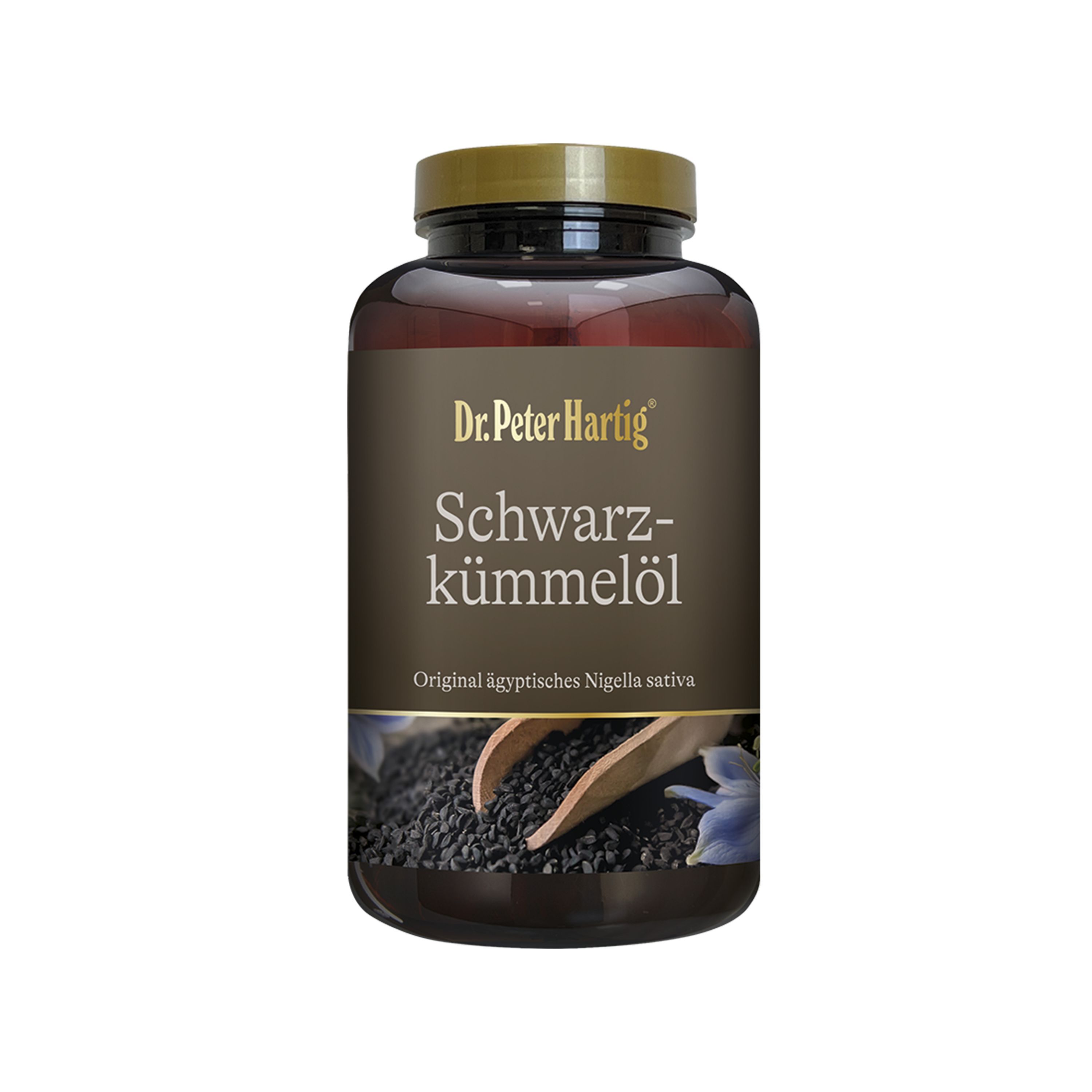 Braune Flasche mit goldfarbenem Deckel. Aufschrift: Dr. Peter Hartig Schwarzkümmelöl. Schwarze Samen und Holzschaufel.