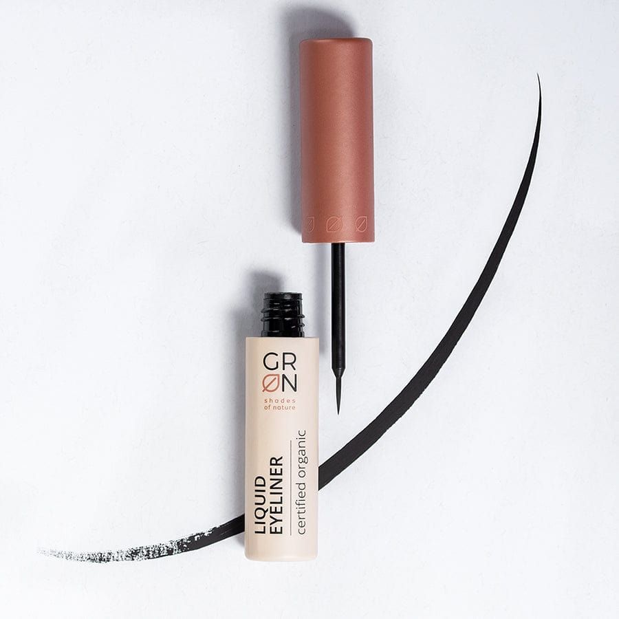 Flüssiger Eyeliner mit Pinsel und schwarzem Lidstrich. Aufschrift: GRN, Liquid Eyeliner, certified organic.