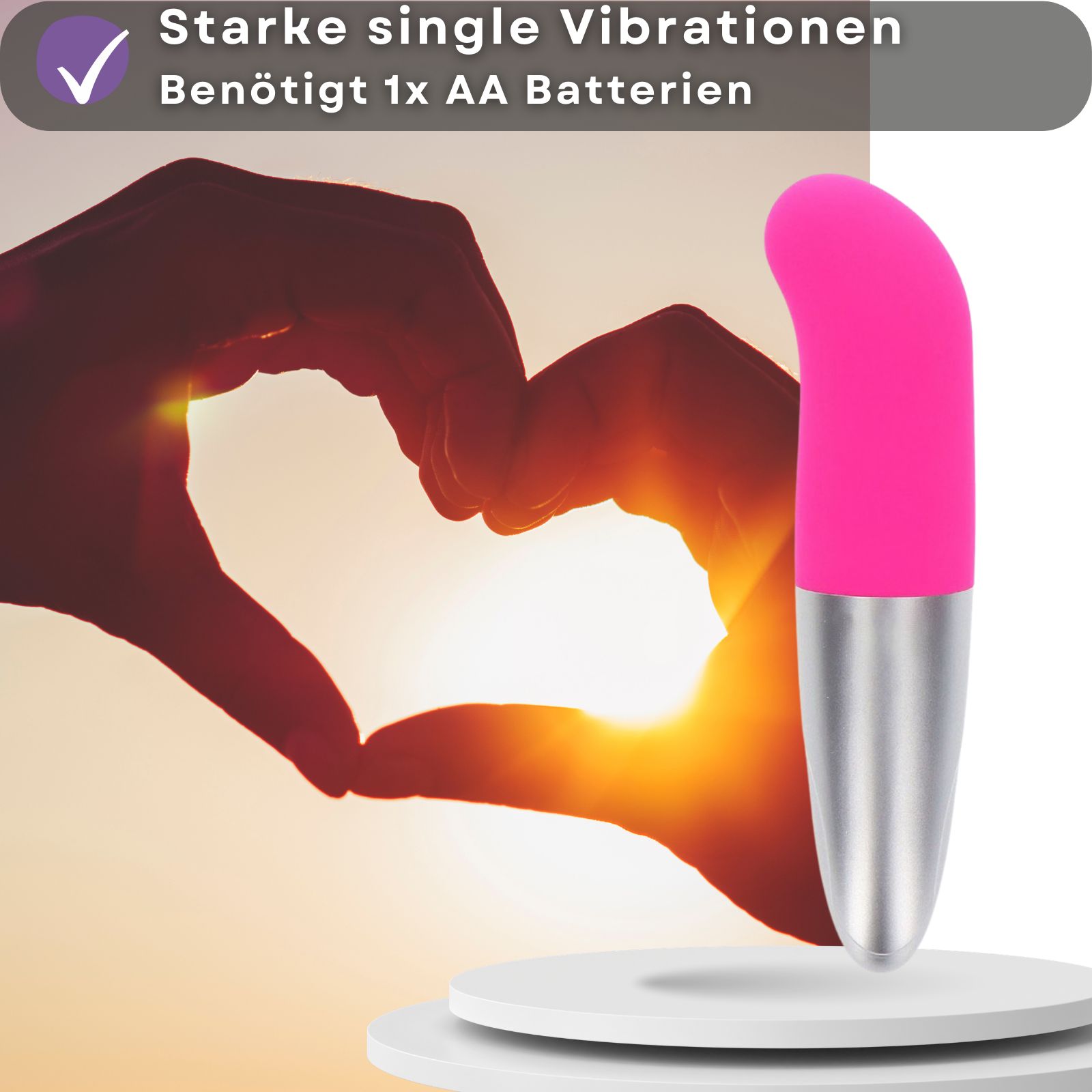 Pinkfarbener Vibrator mit silberfarbenem Schaft. Benötigt 1 AA Batterie.