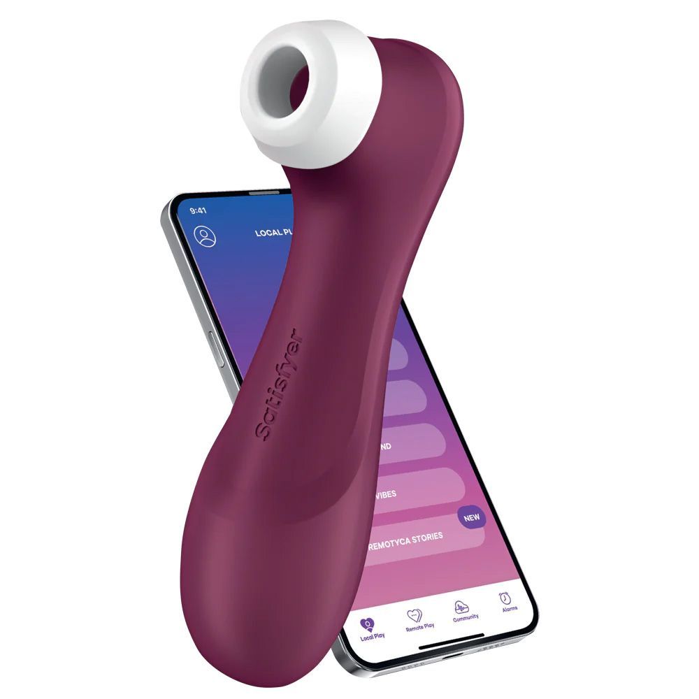 Paars apparaat met witte opzet, naast smartphone met app-interface. Merk: Satisfyer.