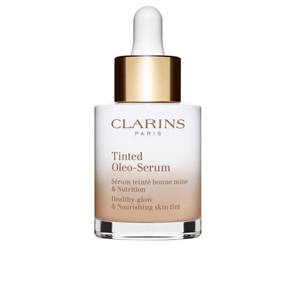 Clarins Tinted Oleo-Serum Flasche. Weißes Glas, goldener Deckel, Pipette. Text: Clarins Paris, Tinted Oleo-Serum, Healthy-glow & Nourishing skin tint.