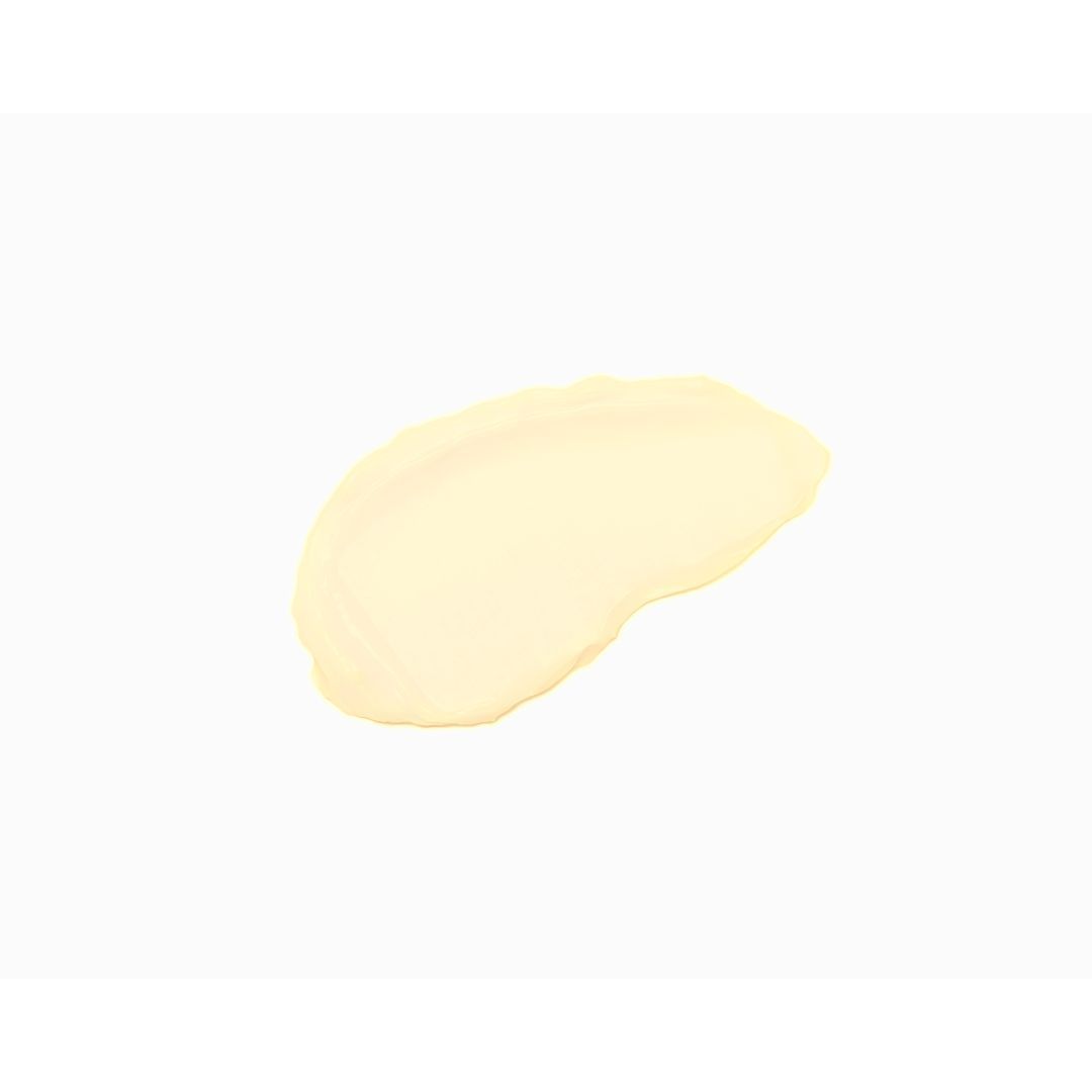 Gelbliche Creme auf weißem Hintergrund. Form: unregelmäßig, länglich.