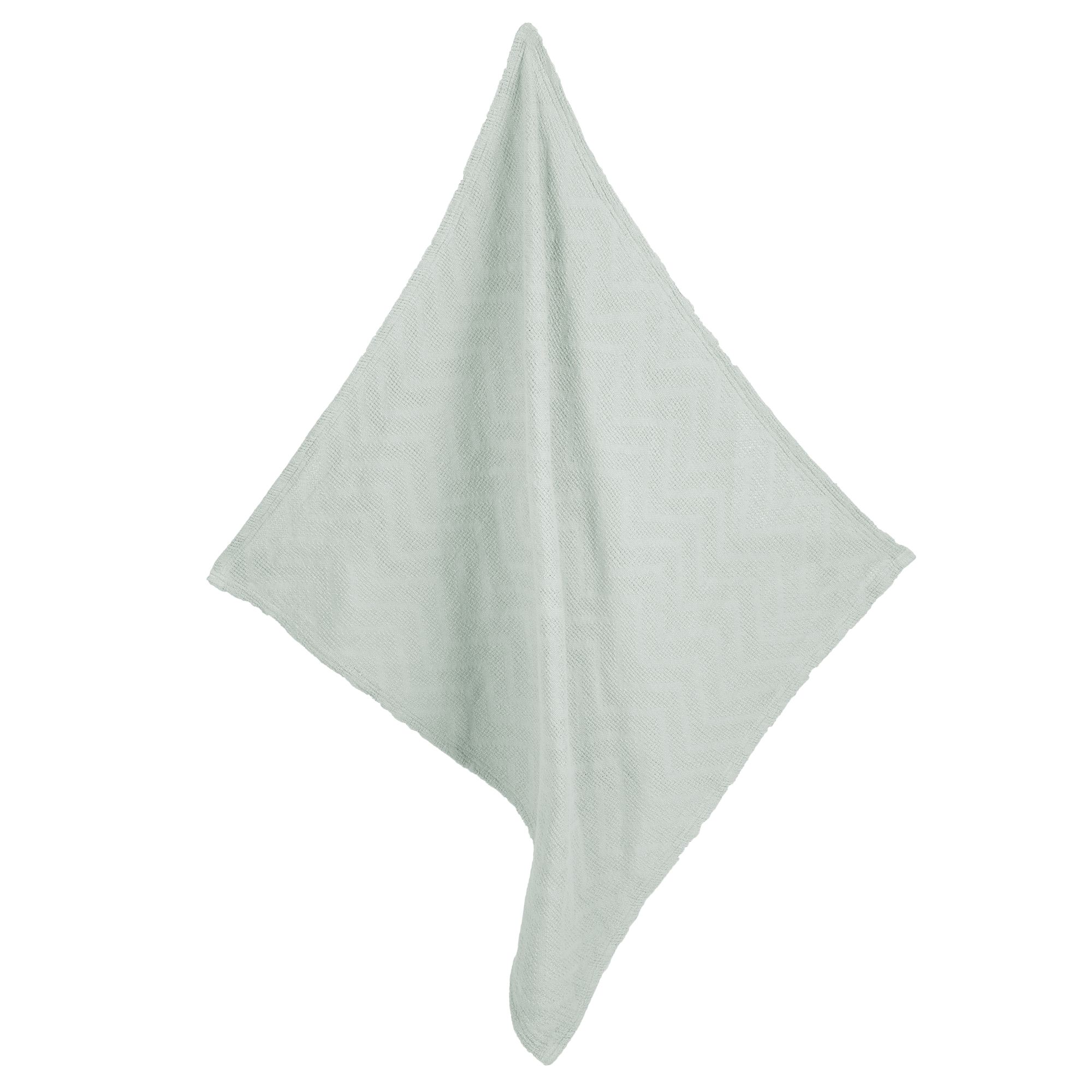 Hellgrüne Decke in Strickoptik, gefaltet. Quadratische Form.
