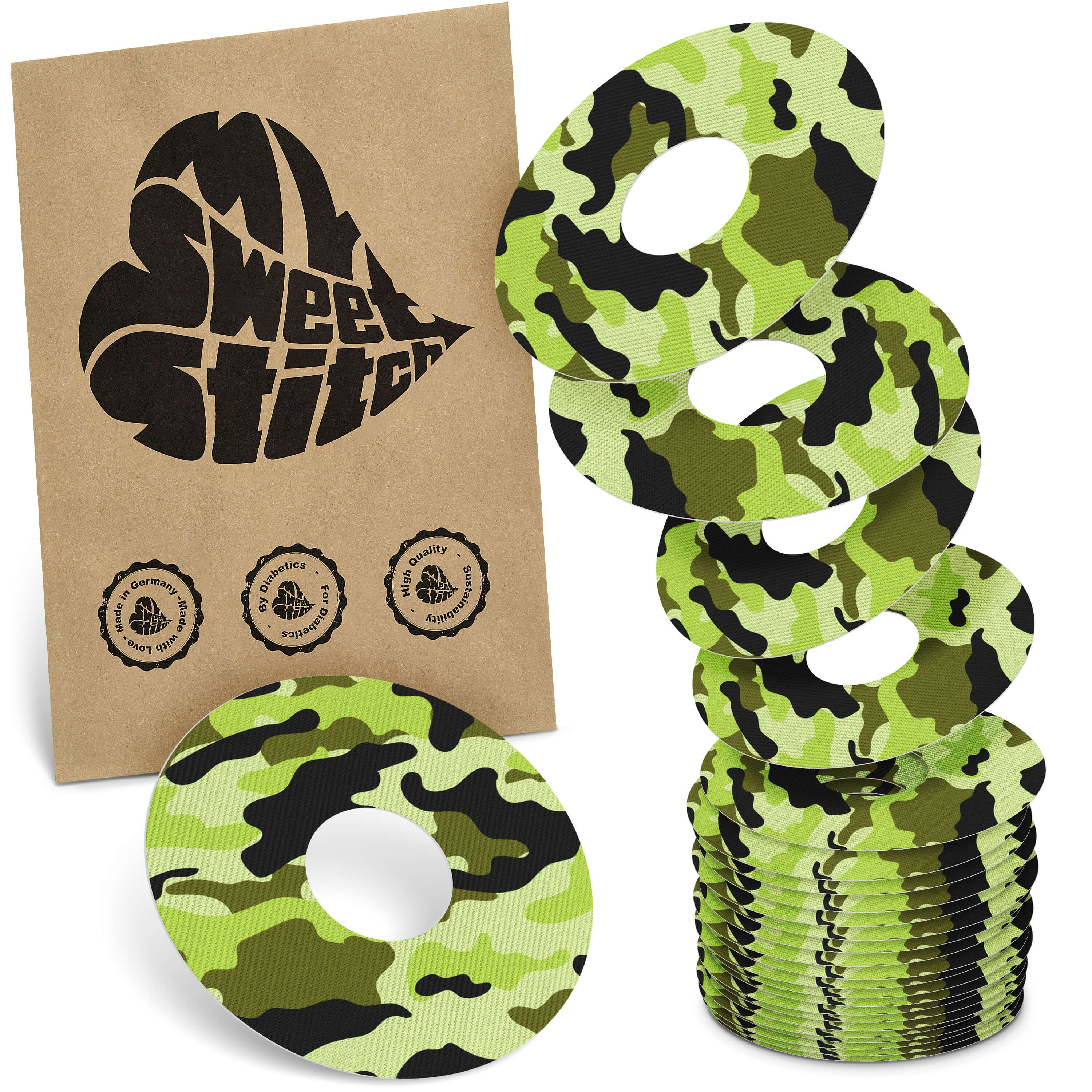 Ringpflaster mit Camouflage-Muster. Braune Verpackung mit Logo und Qualitätssiegeln.