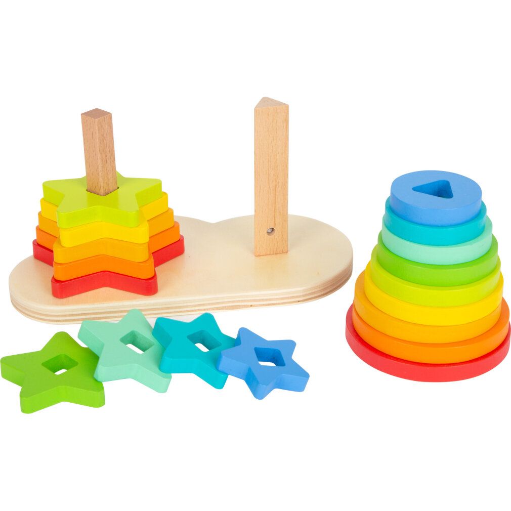 Holz-Steckspiel mit Stern- und Ringformen in Regenbogenfarben. Auf einer Holzbasis mit zwei Stiften. Lose Sterne liegen daneben.