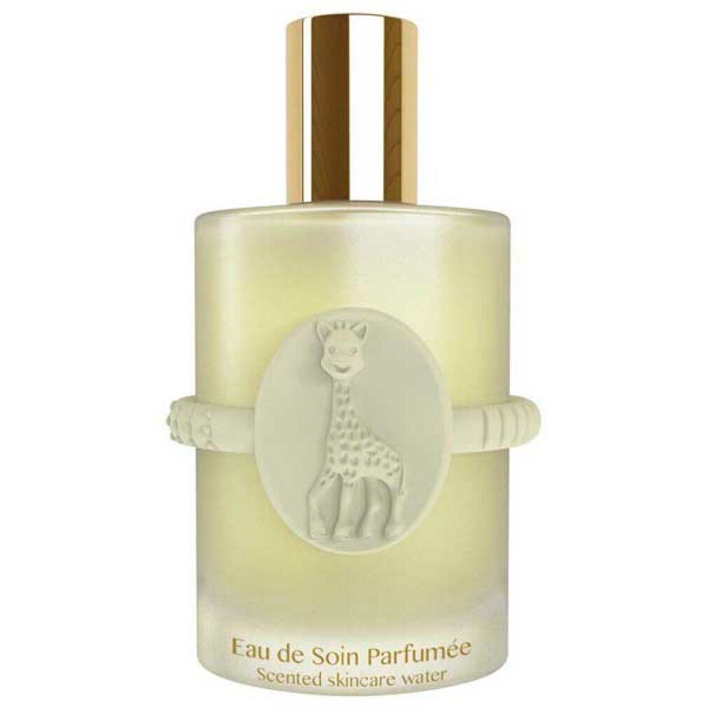 Parfümflakon mit Giraffen-Emblem. Text: Eau de Soin Parfumée, Scented Skincare Water. Weißes Band mit Noppen. Goldfarbener Verschluss.