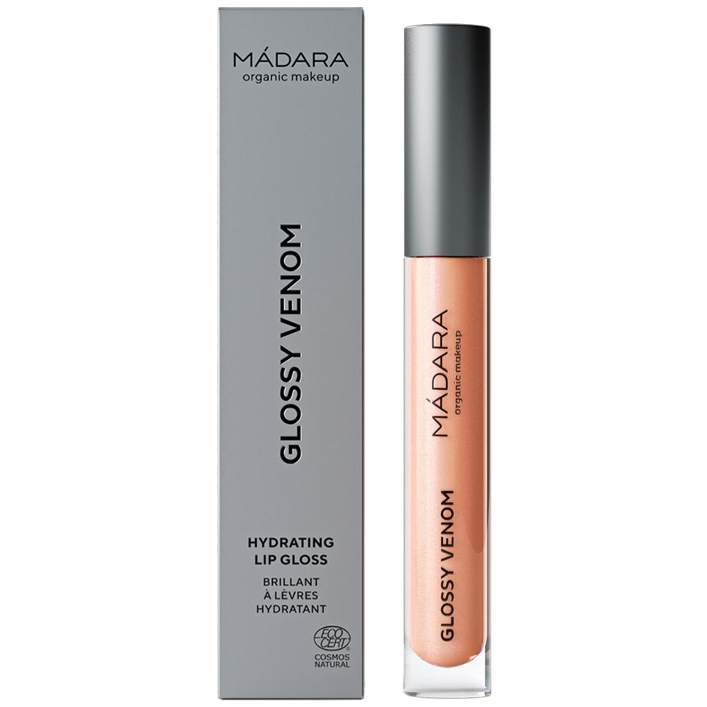 Lucidalabbra con confezione grigia. Nome del prodotto e marchio visibili. Tonalità Nude Coral. Certificazione COSMOS NATURAL.