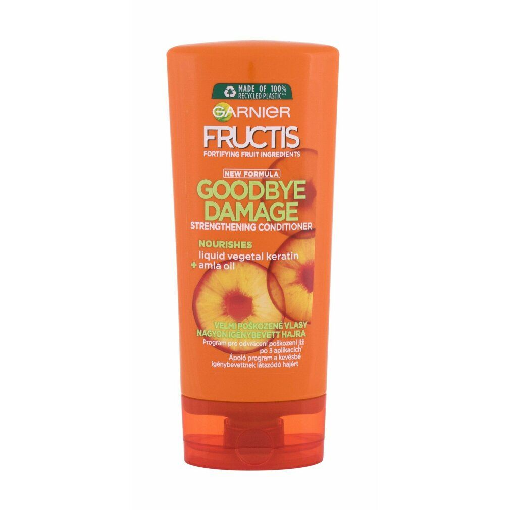 Orangefarbene Tube mit Garnier Fructis Goodbye Damage. Text: Strengthening Conditioner, Nourishes, Liquid vegetal keratin + amla oil.