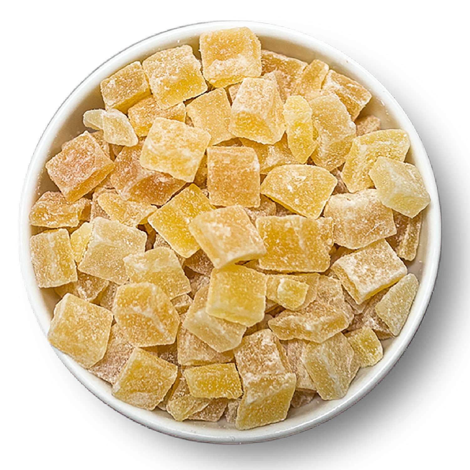 Gehackte, kandierte Mango in einer weißen Schale. Die Stücke sind quadratisch und gelb-braun.