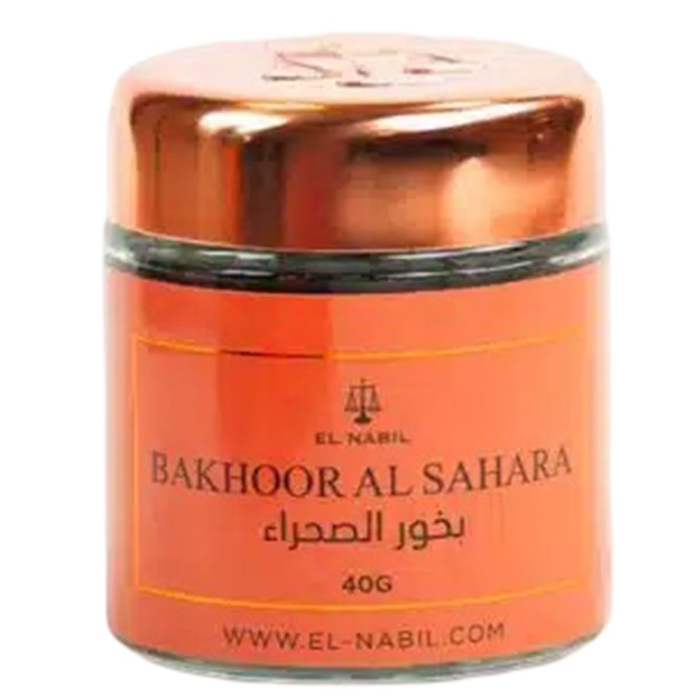 Runder Glasbehälter mit kupferfarbenem Deckel. Auf dem orangefarbenen Etikett steht "Bakhoor Al Sahara" und "El Nabil".