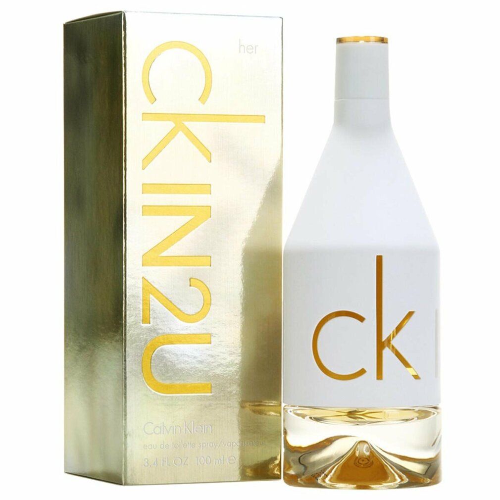 Parfümflakon und Verpackung. Flakon weiß mit goldfarbenem "ck". Verpackung goldfarben mit "CK IN2U her".
