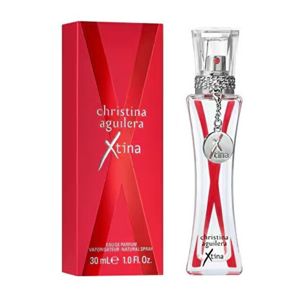 Christina Aguilera Xtina Eau de Parfum Flakon mit roter Verpackung, silbernem Anhänger und rotem X-Design.