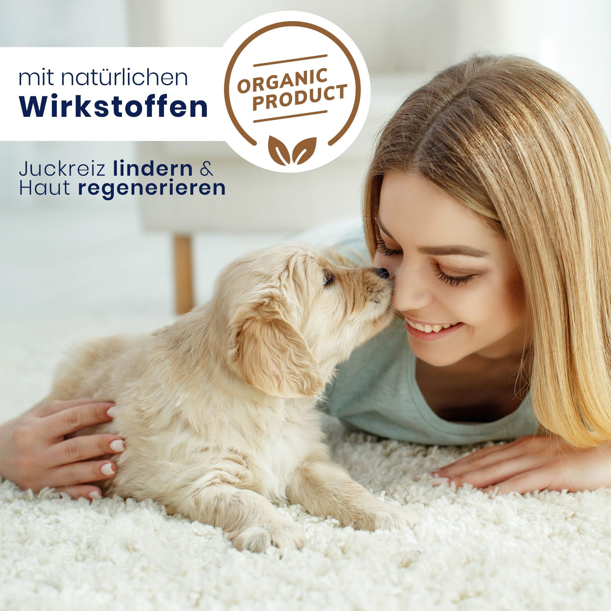 Frau mit Hund. Hund leckt Gesicht der Frau. Text: mit natürlichen Wirkstoffen, Organic Product. Teppich.
