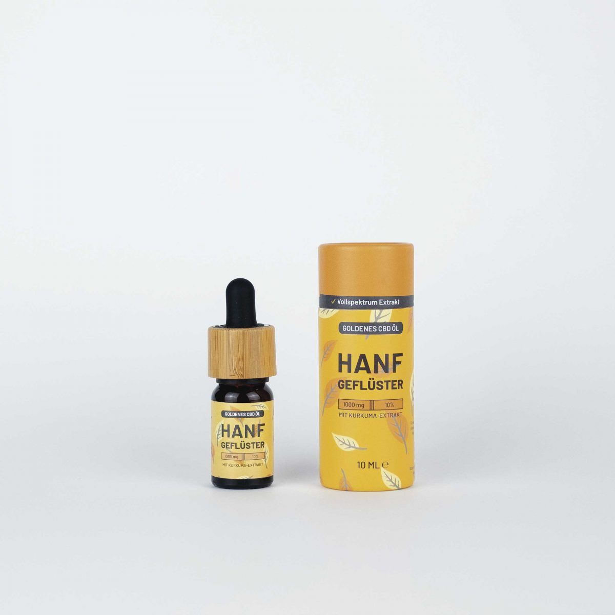 Braune Glasflasche mit Tropfer und zylindrischer Verpackung. Aufschrift: HANFGEFLÜSTER, 10 ml.