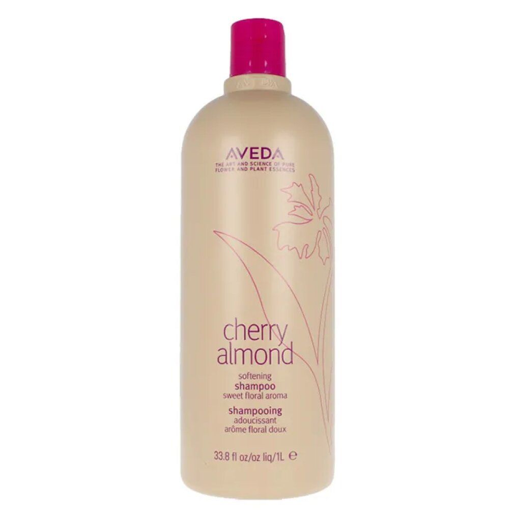 Beige Shampoo-Flasche mit pinkfarbenem Deckel. Aufschrift: Aveda, Cherry Almond, Shampoo. 33.8 fl oz/1L.