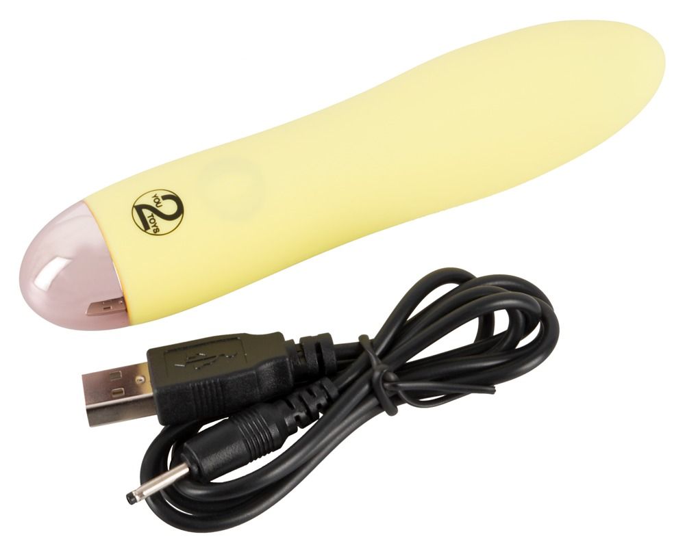 Gelber Vibrator mit USB-Kabel. Rosa Spitze, glatte Oberfläche.