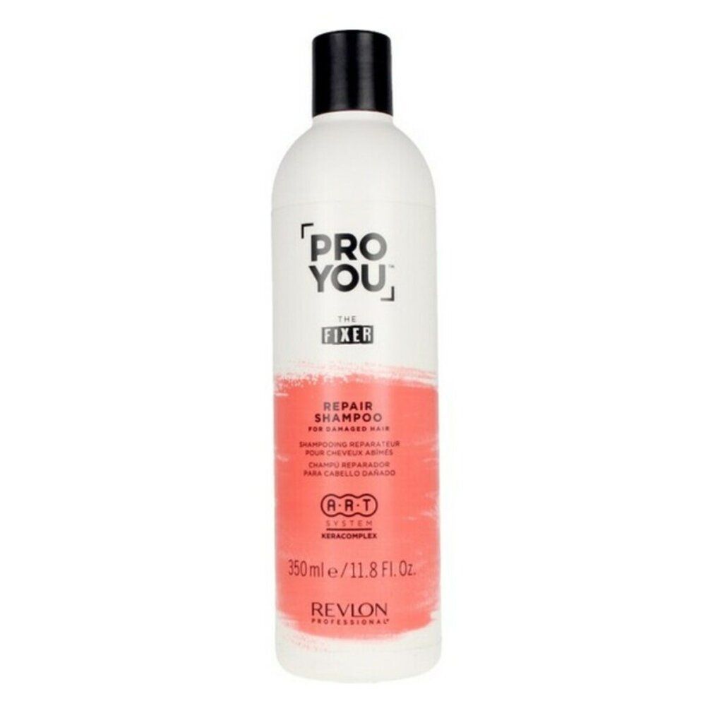 Weiße Flasche mit schwarzem Deckel. Aufschrift: PRO YOU THE FIXER REPAIR SHAMPOO. Revlon-Logo und Text in Rot.