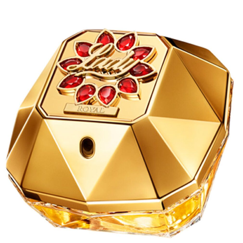 Goldfarbener Flakon mit rotem Schmuck.