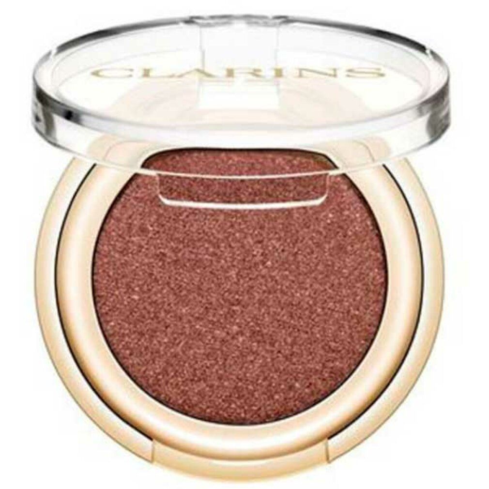 Runder Lidschatten-Kompakt in goldfarbenem Behälter mit durchsichtigem Deckel. Deckel geöffnet.