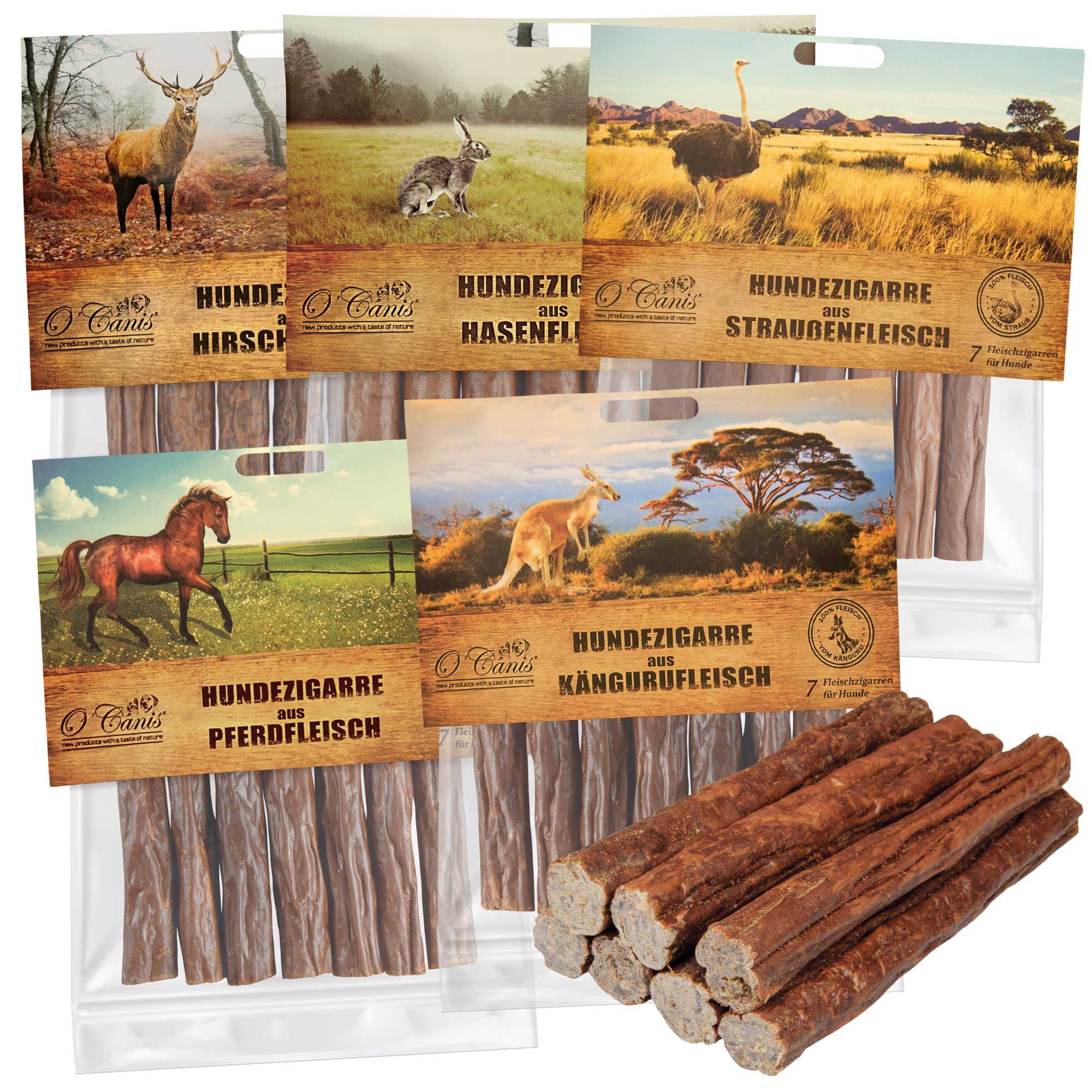Set von 5 Hundezigarren-Packungen. Jede Packung zeigt ein Tierbild und enthält 7 Zigarren. O'Canis Logo.