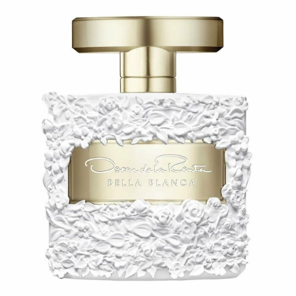 Parfümflakon mit weißem Blumendekor. Goldfarbener Verschluss. Aufschrift: Oscar de la Renta Bella Blanca.