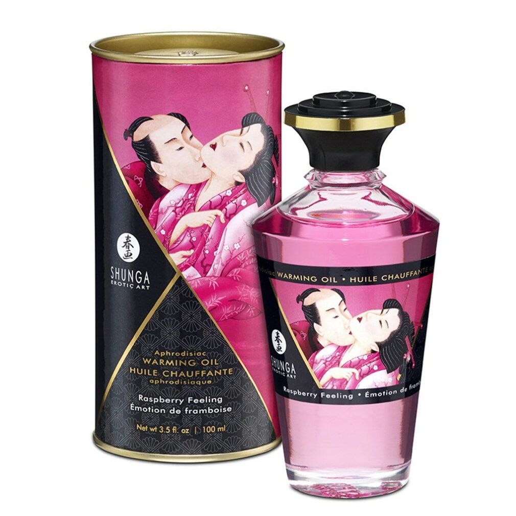 Frambozen massageolie met verpakking. Fles en doos met illustraties. Opschrift: Shunga, Warming Oil.
