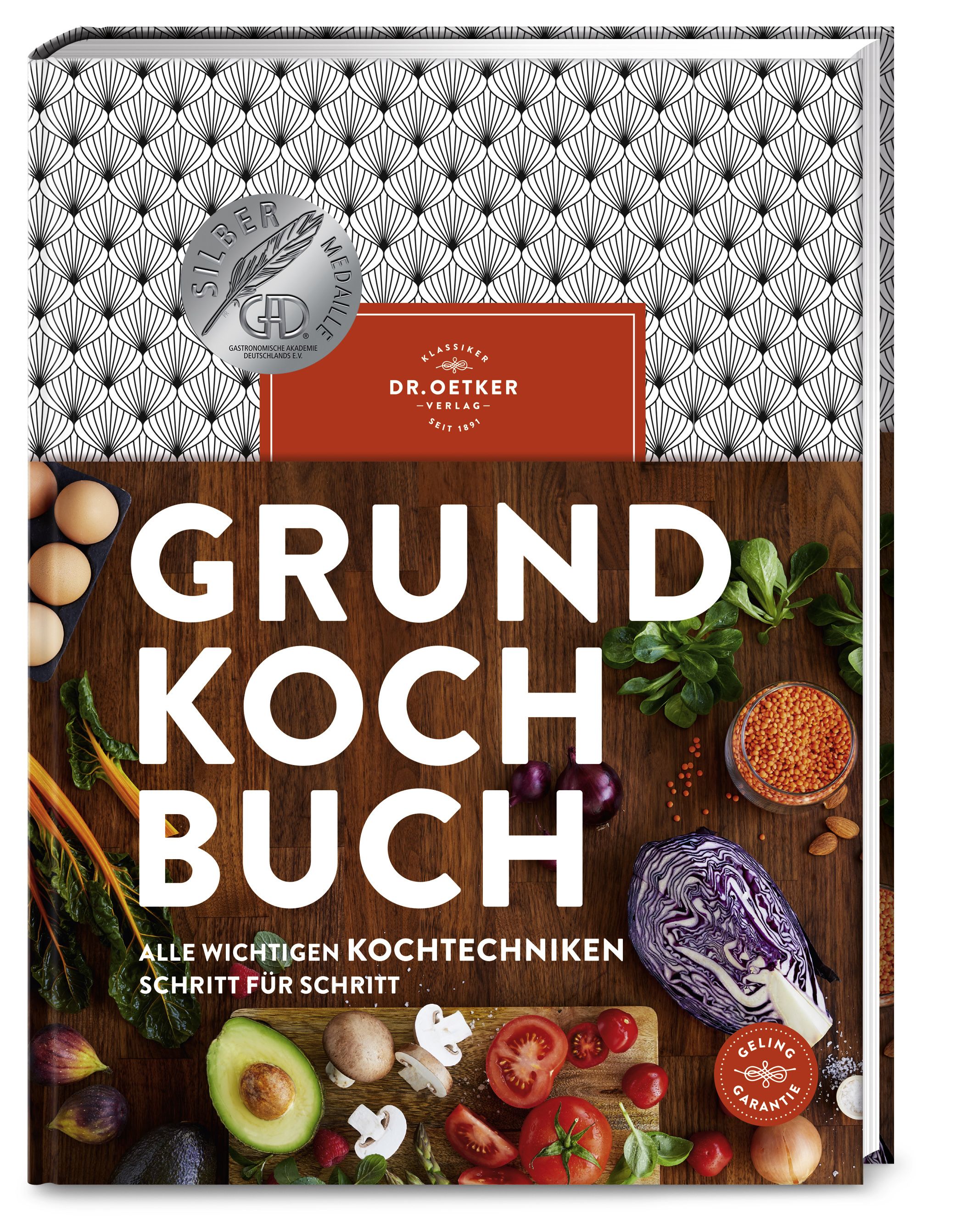 Kochbuch mit dem Titel „GRUND KOCH BUCH“. Auf dem Cover sind Zutaten wie Gemüse und Eier abgebildet. Verlag: Dr. Oetker.