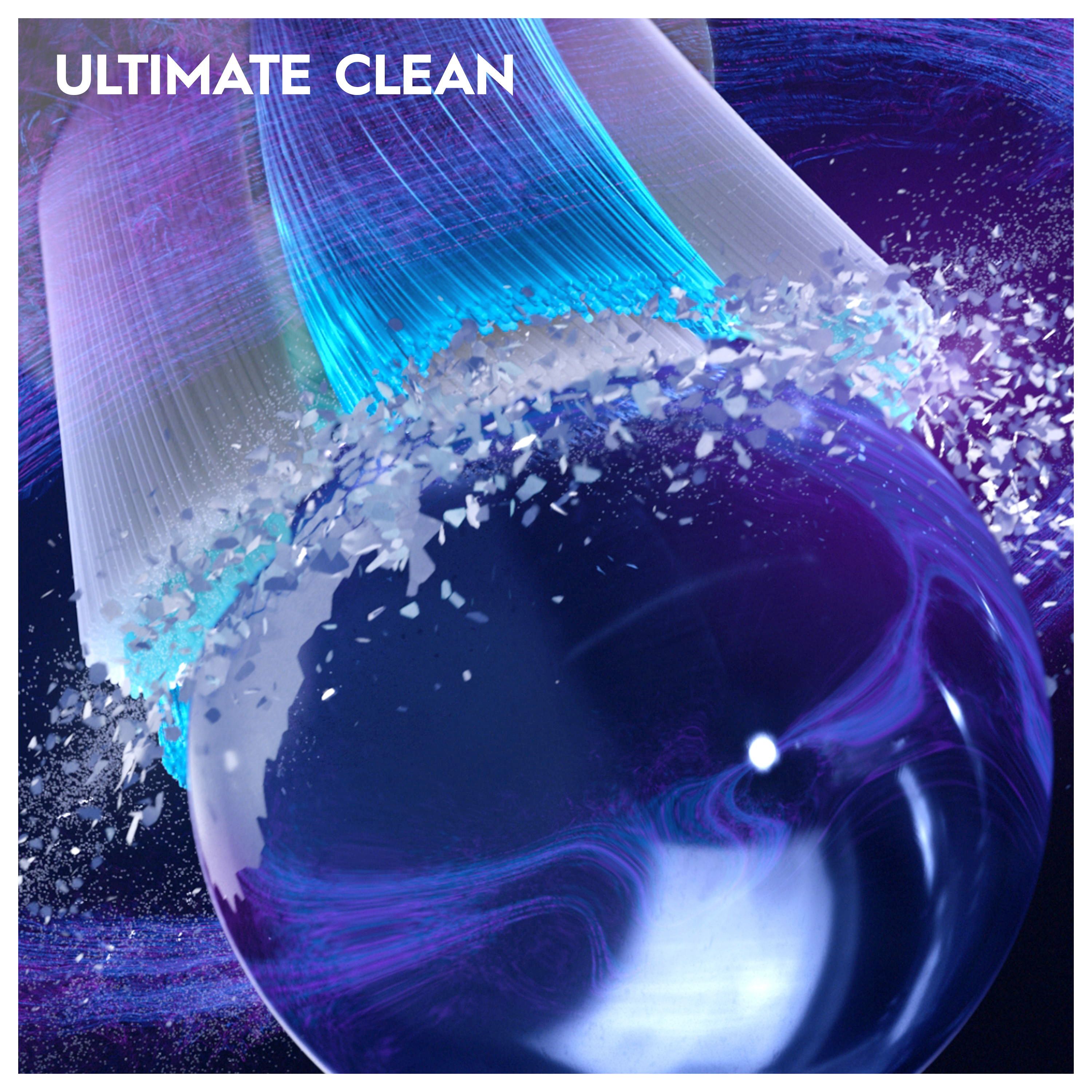 Nahaufnahme einer Zahnbürste. Blaue und weiße Borsten. Text: ULTIMATE CLEAN. Blaue Lichteffekte.