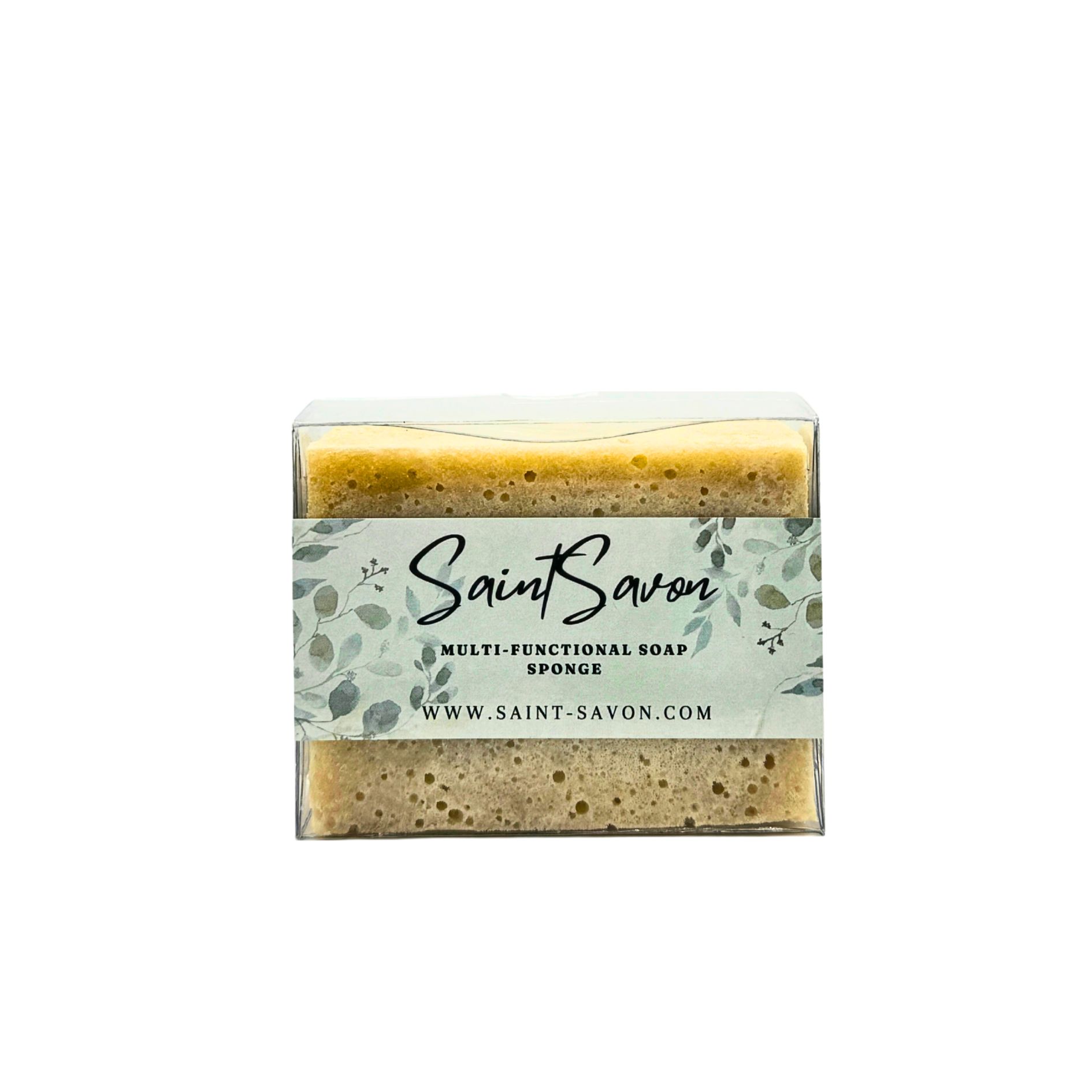 Rechteckiger Schwamm in transparenter Verpackung. Auf dem Etikett steht "Saint Savon", "Multi-Functional Soap Sponge" und die Website.