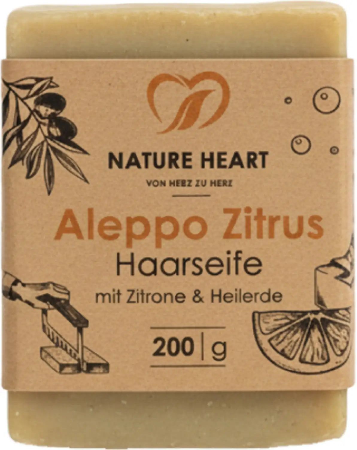 Seife mit Papierbanderole. Aufschrift: Aleppo Zitrus Haarseife mit Zitrone & Heilerde. Marke: Nature Heart. Gewicht: 200 g.