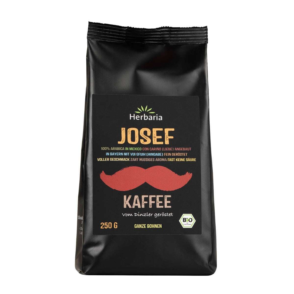 Schwarzer Beutel mit Aufdruck. Aufschrift: Herbaria Josef Kaffee, 250g, Bio-Siegel. Roter Schnurrbart.