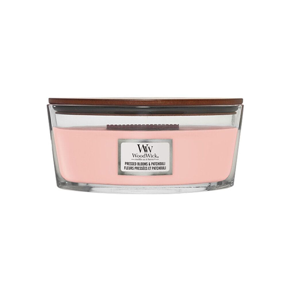 Kerze mit Holzdocht, rosa Wachs in Glasbehälter mit Holzdeckel. Label mit "WoodWick" und Produktbezeichnung.