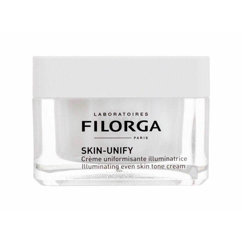 Creme-Tiegel mit weißem Deckel. Aufschrift: FILORGA SKIN-UNIFY. Klare Verpackung.